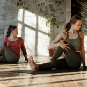 two women doing yoga