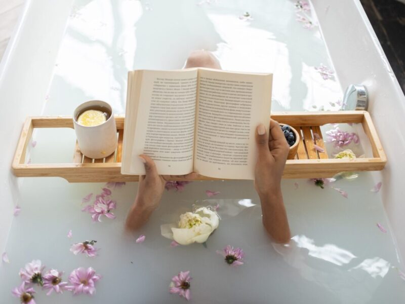 a person reading a novel in the bath