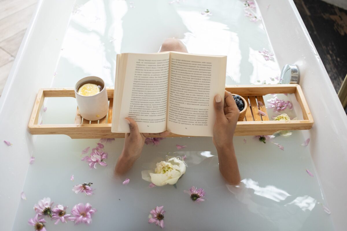 a person reading a novel in the bath
