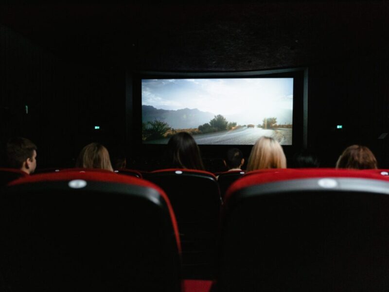 people watching a movie in the movie theater