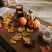 fall table with book and pumpkins